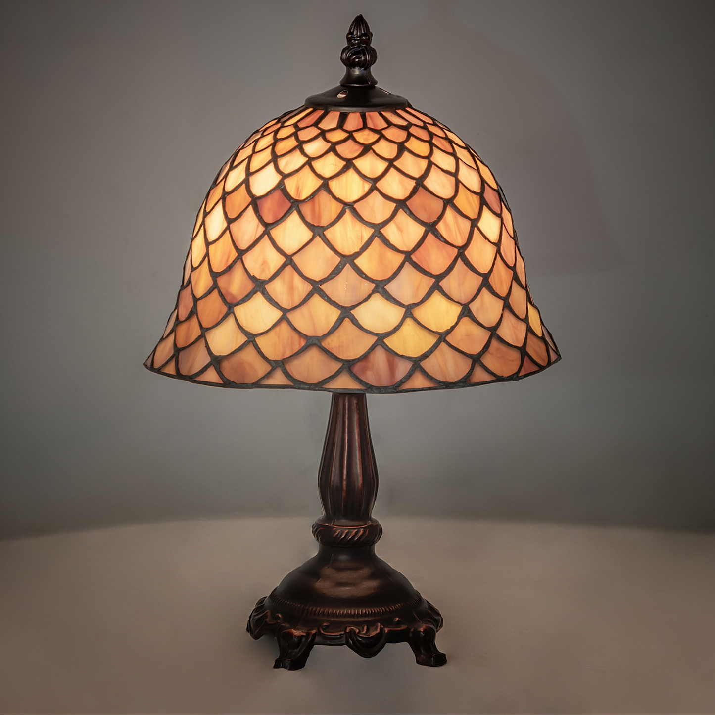 12-inch small tiffany lamp fishscale on dark background. 