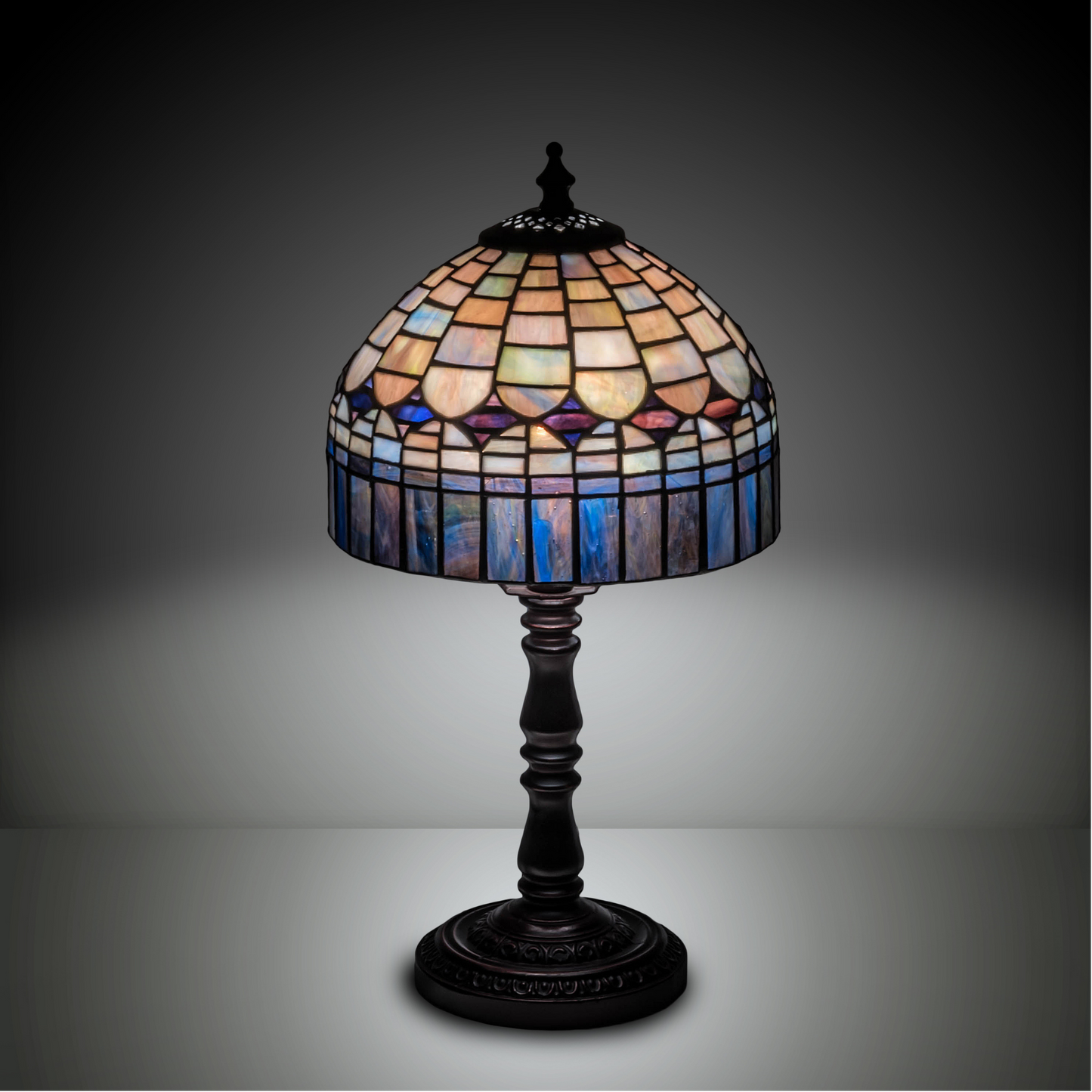 14-inch small tiffany lamp candice on dark background. 