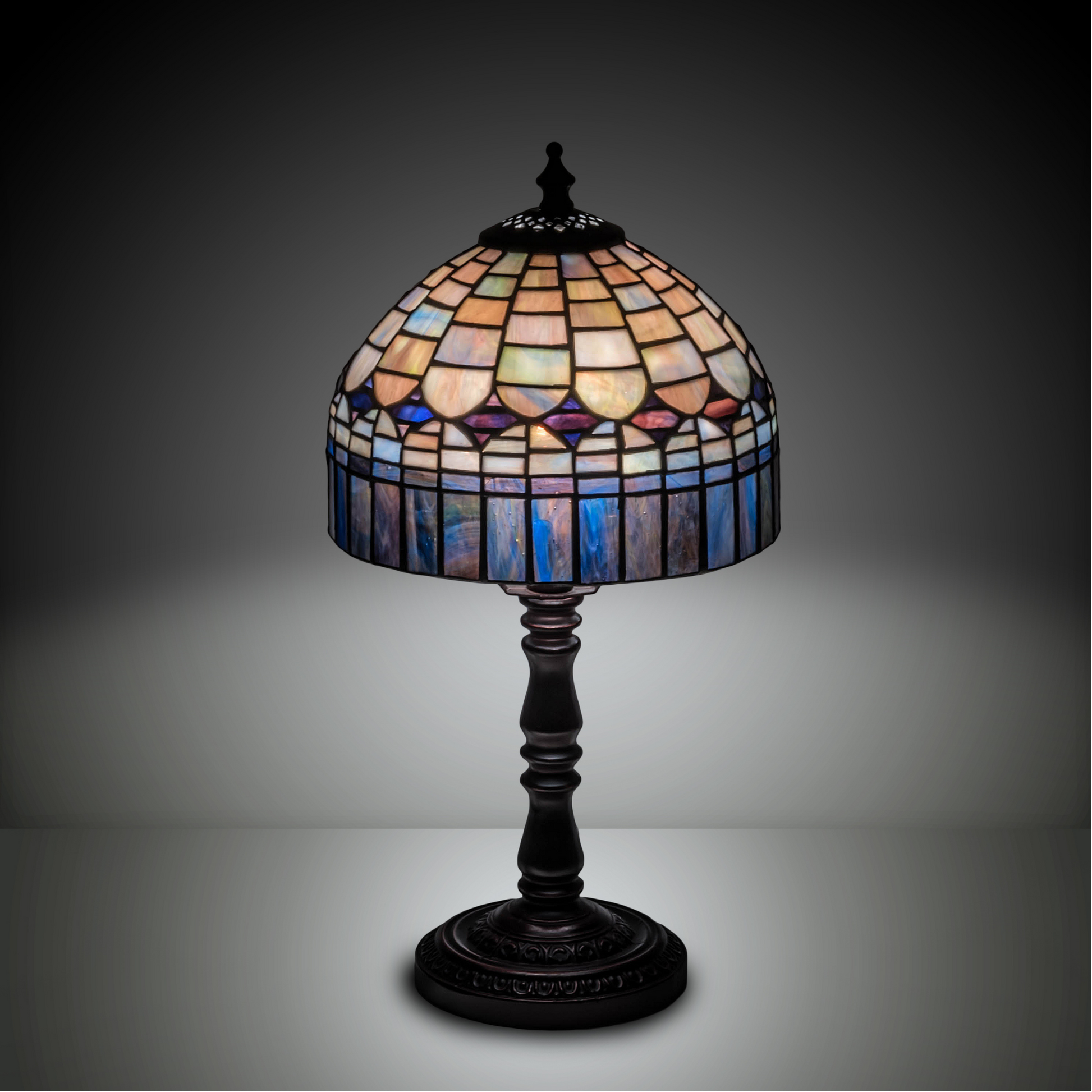 14-inch small tiffany lamp candice on dark background. 