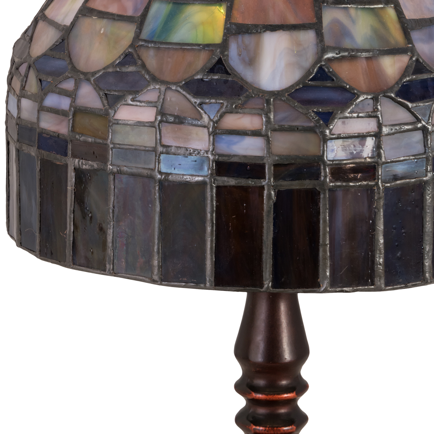 14-inch small tiffany lamp candice on dark background. Close off of glass shade. Light off. 