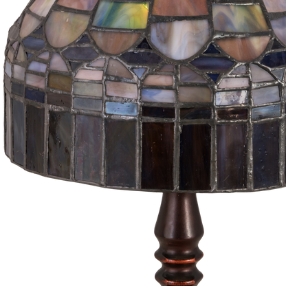 14-inch small tiffany lamp candice on dark background. Close off of glass shade. Light off. 
