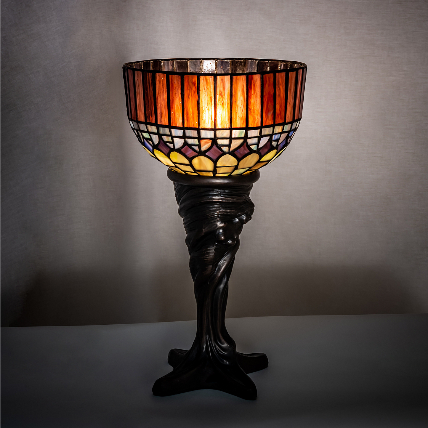 15 inch small tiffany lamp candice on dark background. 