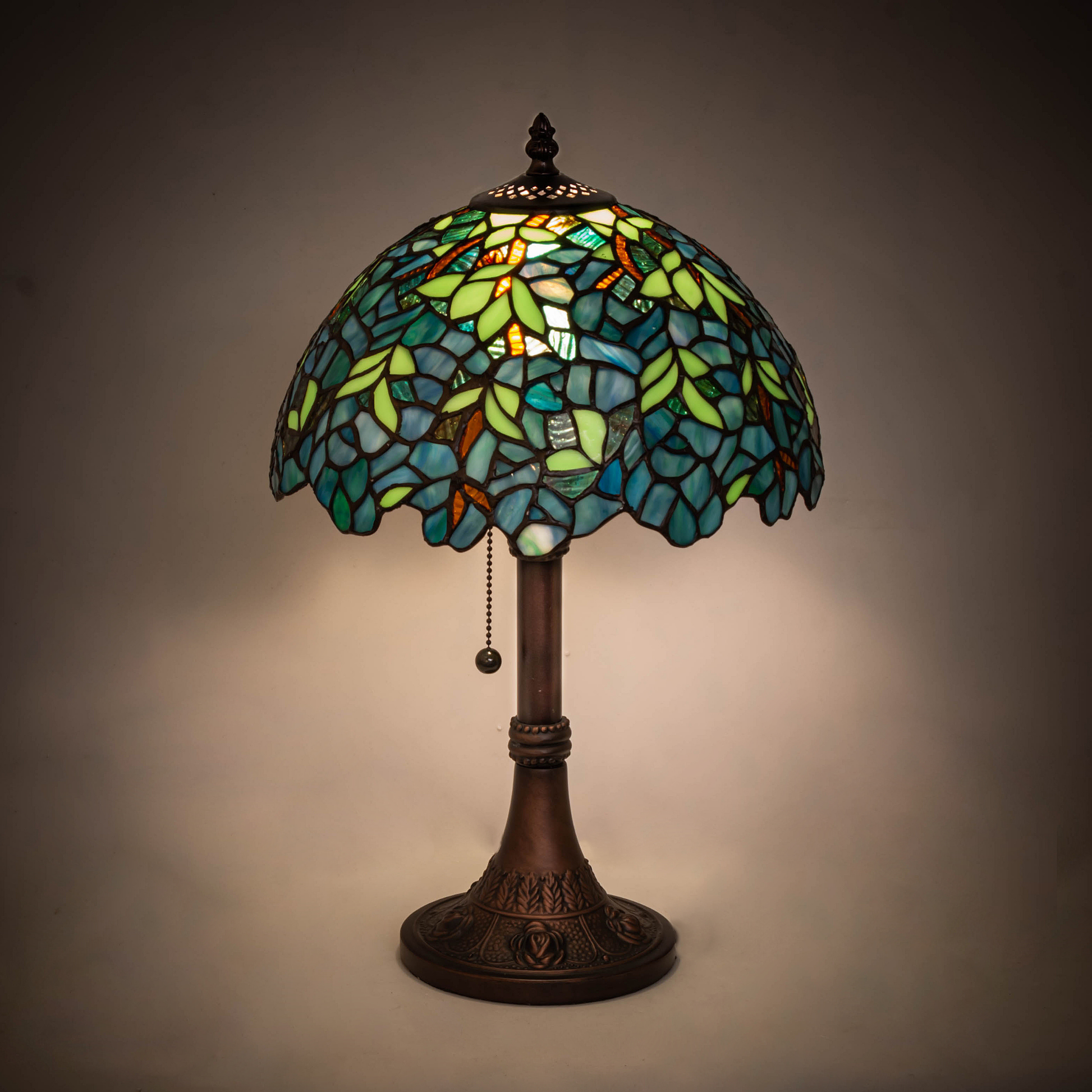 17-inch Tiffany Table Lamp Wisteria Nightfall on dark background. 