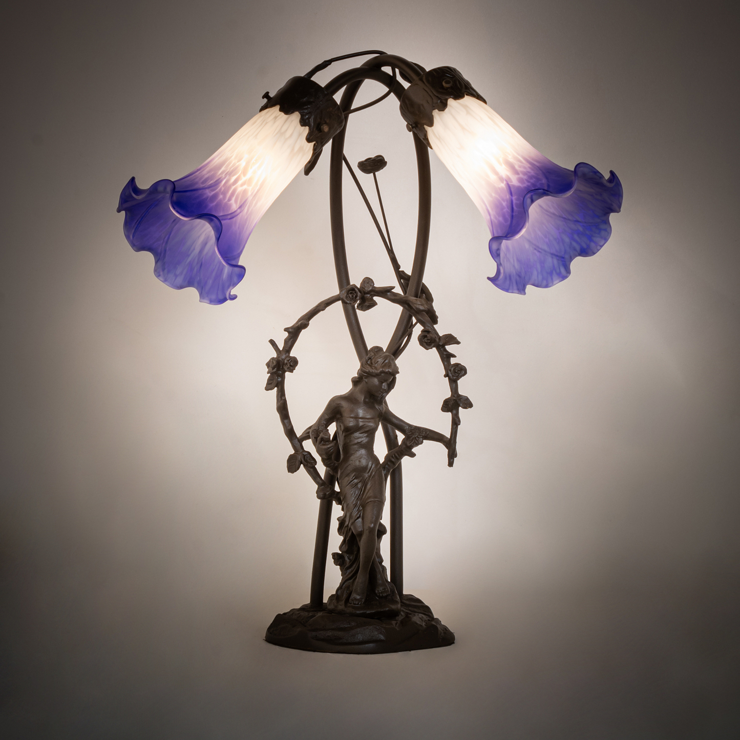 17-inch tiffany glass table lamp Blue/White Pond Lily Trellis Girl Accent on dark background