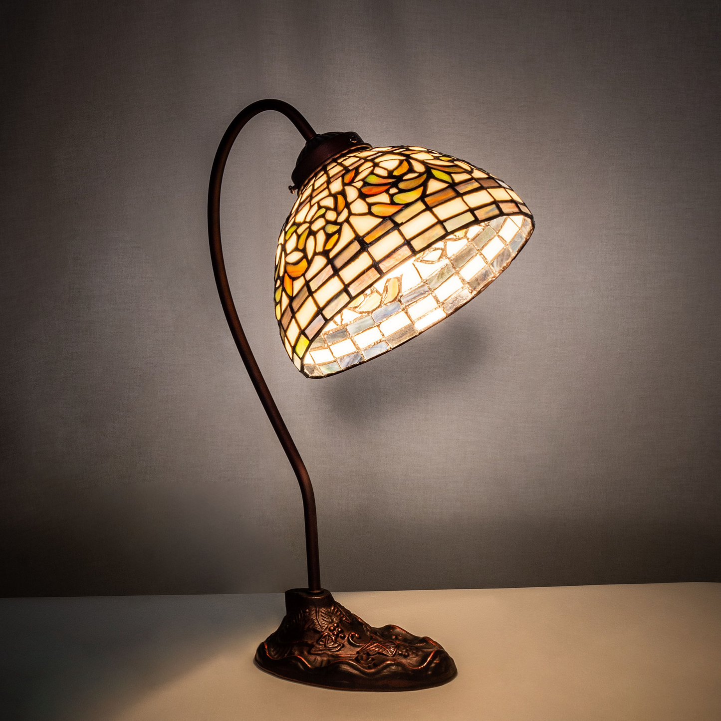 18-inch tiffany desk lamp turning leaf on dark background. 