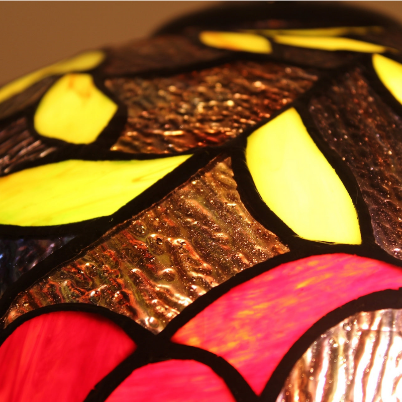 Close-up view of stained glass texture and color. Tiffany Like Table Lamp Mariebelle Floral by Chloe Lighting